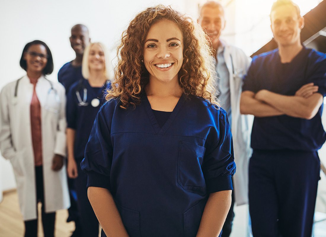 Employee Benefits - Group of Medical Professionals Smiling for Portrait